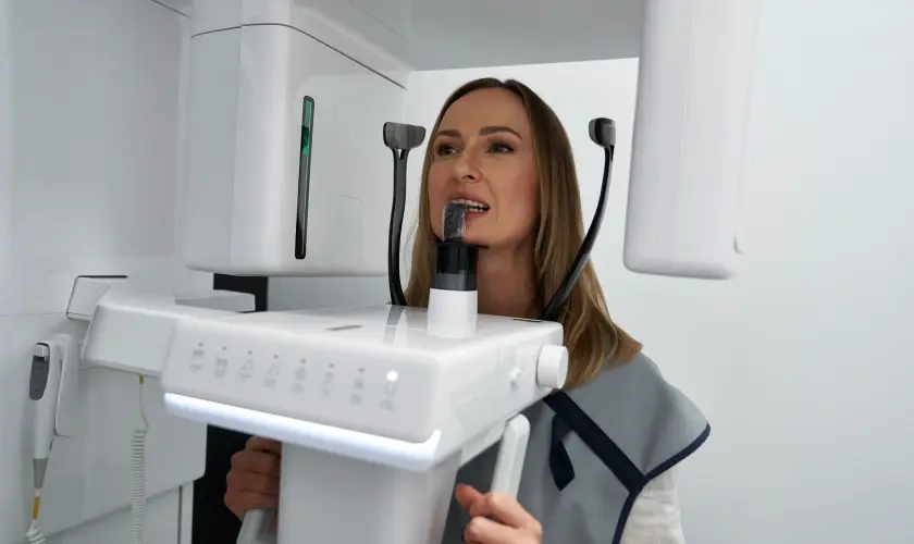 Dental professional demonstrating airway treatment equipment used for facial development assessment in Niceville, FL.